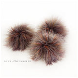 Autumn Grey Pom Grey with purple, yellow, red and orange strands throughout. Dark grey striping Medium length fur (approximately 2") Beautiful coloring and soft feel