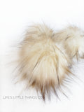 Buttercream Pom Cream color with tan and brown tips *Long length fur (approximately 2-3") *Full look and soft feel