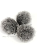 Cottontail Pom Grey in color throughout with white hairs Short length fur (approximately .5")