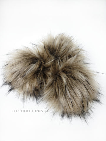 A fun, modern touch to your knitwear.  Make a STATEMENT with a faux fur poof.  Each pom is handmade with high quality faux fur (vegan). Price is for 1 Taupe Faux Fur Pom Pom