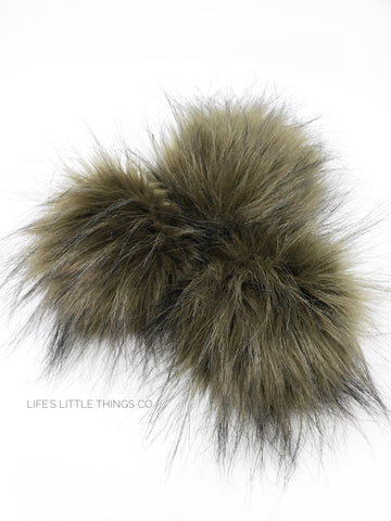 A fun, modern touch to your knitwear.  Make a STATEMENT with a faux fur poof.  Each pom is handmade with high quality faux fur (vegan). Price is for 1 Olive Faux Fur Pom Pom