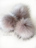 A fun, MODERN touch to your knitwear. Make a STATEMENT with a faux fur poof. Each pom is handmade with high quality faux fur (vegan). 3 sizes available with 2 nylon strings or a snap.  Permanent or detachable pom poms. Use for hat toppers, scarf ends, key chains, purse bling, headbands...options are limitless