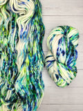 CLOUD from Indie Dyer, Threadhead Knits.  It's just that, clouds of Superwash Merino Wool.  Super-soft, super-warm, super-quick: this single ply yarn is hand-dyed in small batches.