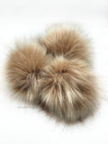 A fun, modern touch to your knitwear.  Make a STATEMENT with a faux fur poof.  Each pom is handmade with high quality faux fur (vegan).