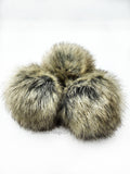 A fun, modern touch to your knitwear.  Make a STATEMENT with a faux fur poof.  Each pom is handmade with high quality faux fur (vegan).
