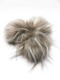 A fun, modern touch to your knitwear.  Make a STATEMENT with a faux fur poof.  Each pom is handmade with high quality faux fur (vegan).