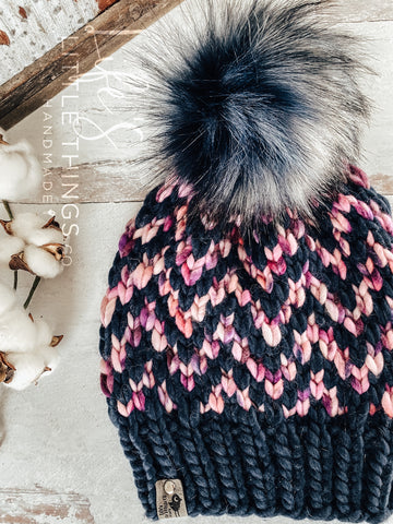 Live. Love. Stay Cozy. Out on the town or on a neighborhood stroll, you will stay warm all fall and winter in this handmade, modern beanie with a large snap on pom-pom to add a little flair.  Kettle dyed Merino wool in pinks, purples and navy blues.  Topped with a HANDMADE snap on faux fur pom-pom in variations of white and dark blue. Thick weight beanie.