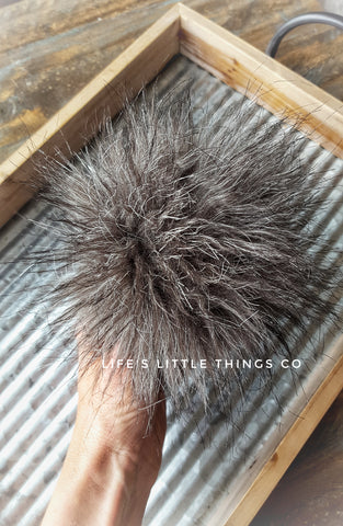 Black Wolf Pom Dark grey in color with strands of black and white throughout *Medium length fur (approximately 1.5" with some strands reaching 2") *Full look