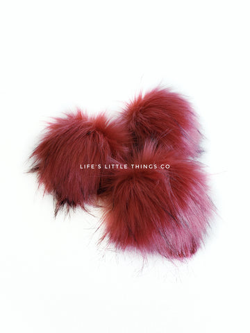 Ruby Pom *Deep red in color with black tips *Long length fur (approximately 2-3") *Full look and soft feel