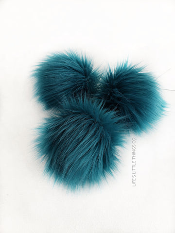 Teal Pom *Blue/green teal color, medium length fur pile *Medium length fur (approximately 2") *Full look and soft feel