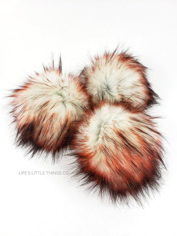 Fire and Ice Pom White center with black and reddish orange tips Medium length fur (approximately 2.5" - 3") Very full pom Luxurious and amazingly soft feel