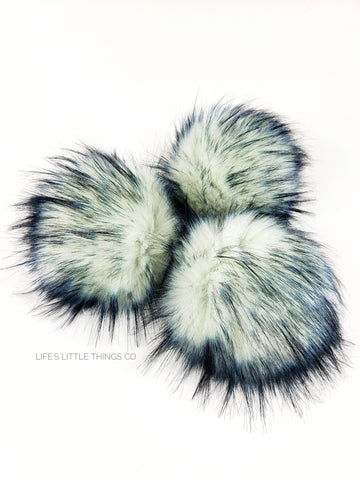 Glacier Pom White center with black and dark blue tips Medium length fur (approximately 2.5" - 3") Very full pom Luxurious and amazingly soft feel
