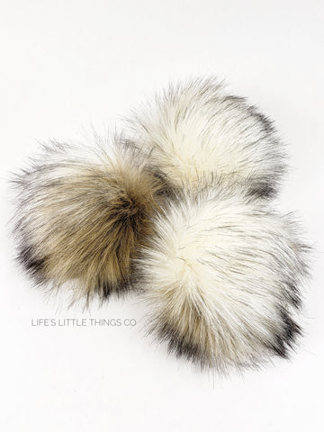 Sandstone Pom Variation of cream (off white) and tan with brown tips. ALL POMS are UNIQUE Medium length fur (approximately 2" - 2.5") Luxurious and amazingly soft feel