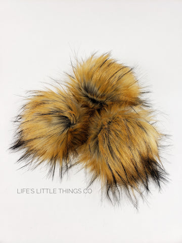 Fire Fox Pom Gray center to a golden/orange end with black tips. Medium length fur (approximately 1.5" - 3") Luxurious and amazingly soft feel