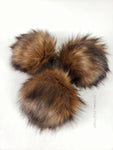 Camel Pom Pom Light brown/camel color in center to dark brown tips.  Medium length fur (approximately 2") Luxurious and amazingly soft feel