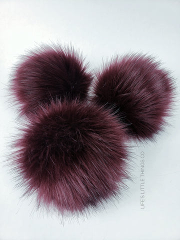 Crimson Pom Pom Deep blood red color with black hairs throughout Long length fur (approximately 2.5") Very full pom Luxurious and amazingly soft feel