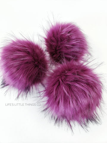 Juneberry Faux Fur Pom Fuchsia with tufts of same color and black tips Long length fur (approximately 1.5" - 2.5") Very full pom Luxurious and amazingly soft feel