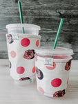 Coral Floral & Dots Iced Drink Snug. Tired of sweating iced drink cups?  Or ice just melting too fast in your cold drink?   Insulate your cup with a modern, stylish cup snug.  Keep your coffee cold, hands warm and water rings off the table.  It may also be used on hot cups.