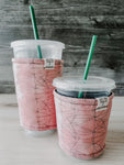 Pink Lines Iced Drink Snug. Tired of sweating iced drink cups?  Or ice just melting too fast in your cold drink?   Insulate your cup with a modern, stylish cup snug.  Keep your coffee cold, hands warm and water rings off the table.  It may also be used on hot cups.