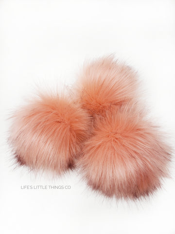 A fun, modern touch to your knitwear.  Make a STATEMENT with a faux fur poof.  Each pom is handmade with high quality faux fur (vegan). Price is for 1 Peachy Faux Fur Pom Pom