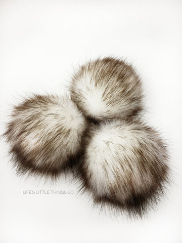 A fun, modern touch to your knitwear.  Make a STATEMENT with a faux fur poof.  Each pom is handmade with high quality faux fur (vegan). Price is for 1 Brulee Faux Fur Pom Pom