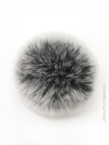 A fun, modern touch to your knitwear.  Make a STATEMENT with a faux fur poof.  Each pom is handmade with high quality faux fur (vegan). Price is for 1 Silver Lining Faux Fur Pom Pom