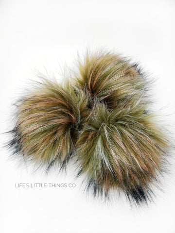 A fun, modern touch to your knitwear.  Make a STATEMENT with a faux fur poof.  Each pom is handmade with high quality faux fur (vegan). Price is for 1 Olive Branch Faux Fur Pom Pom