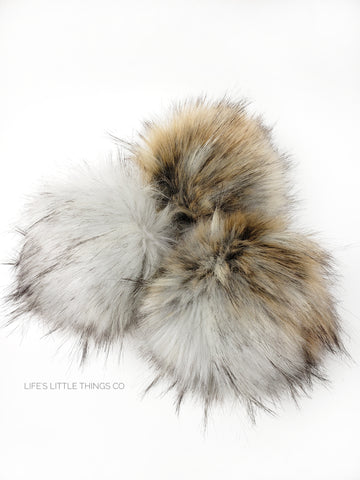 A fun, modern touch to your knitwear.  Make a STATEMENT with a faux fur poof.  Each pom is handmade with high quality faux fur (vegan). Price is for 1 Tawny Faux Fur Pom Pom
