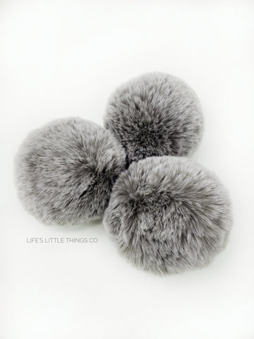 A fun, modern touch to your knitwear.  Make a STATEMENT with a faux fur poof.  Each pom is handmade with high quality faux fur (vegan). Price is for 1 Haze Faux Fur Pom Pom