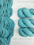 Shasta is a lighter-weight yarn with great durability.  With 100% superwash merino, this hand painted yarn is soft and provides your project with great stitch definition.  This yarn is exclusively spun for Baah Yarn.