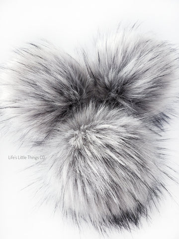 A fun, modern touch to your knitwear.  Make a STATEMENT with a faux fur poof.  Each pom is handmade with high quality faux fur (vegan). Price is for 1 Lux Silver Fox Faux Fur Pom Pom