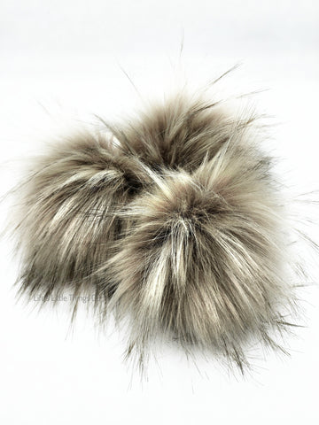 A fun, modern touch to your knitwear.  Make a STATEMENT with a faux fur poof.  Each pom is handmade with high quality faux fur (vegan).