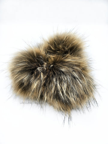 ﻿A fun, modern touch to your knitwear.  Make a STATEMENT with a faux fur poof.  Each pom is handmade with high quality faux fur (vegan).