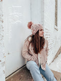 Live. Love. Stay Cozy. Out on the town or on a neighborhood stroll, you will stay warm all fall and winter in this handmade, modern beanie with a large snap on pom-pom to add a little flair.