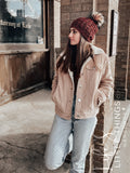 Live. Love. Stay Cozy. Out on the town or on a neighborhood stroll, you will stay warm all fall and winter in this handmade, modern beanie with a medium snap on pom-pom to add a little flair.